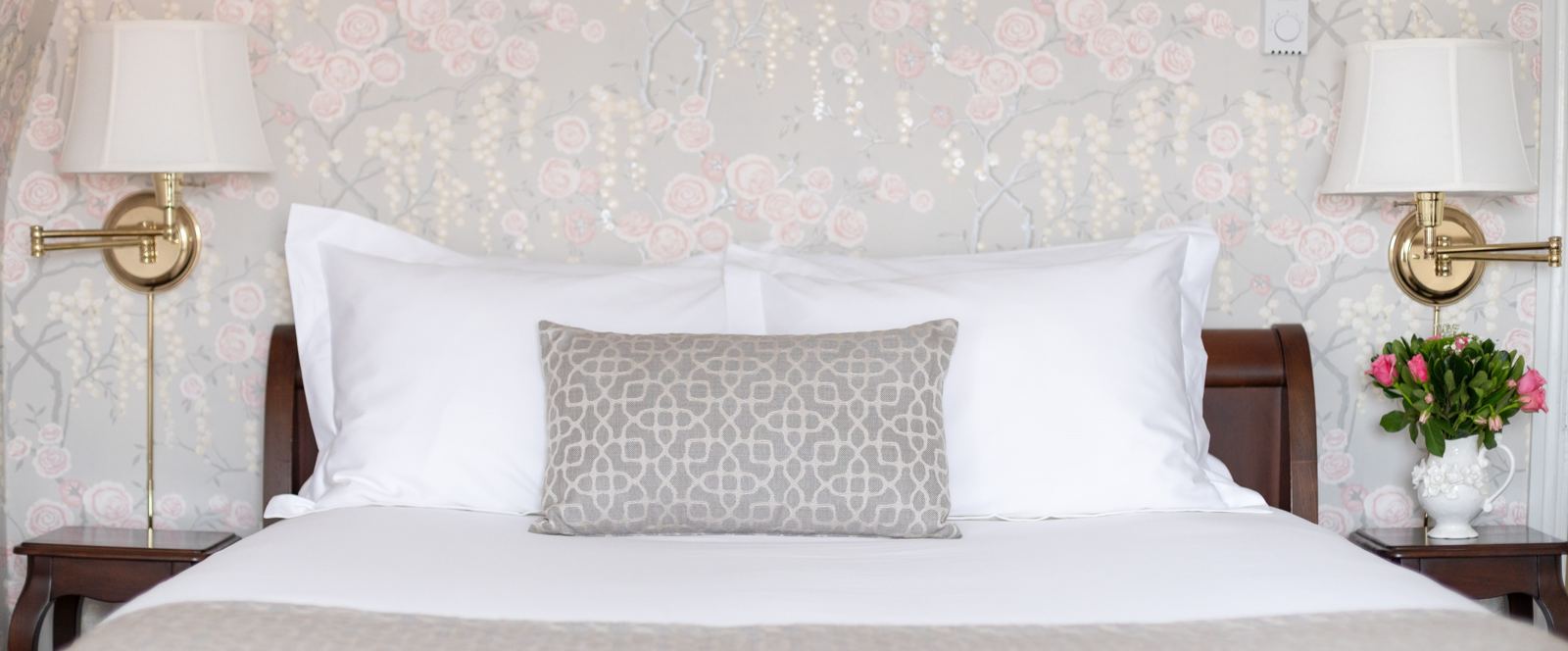 Warne Suite bedroom with floral wallpaper